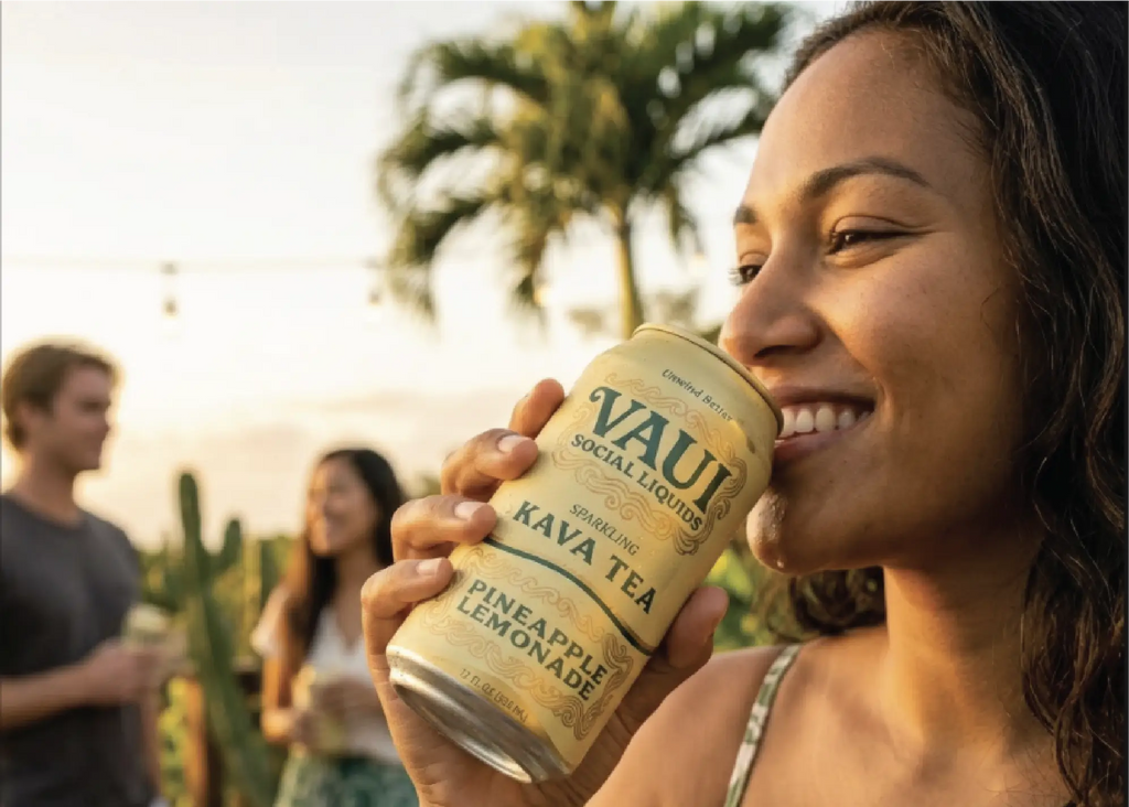 Woman holding a can of Vaui Kava Tea. Unwind Better.